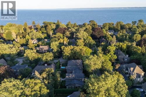 Mature tree canopy surrounding residences - 253 Rossmore Boulevard, Burlington, ON - Outdoor With Body Of Water With View
