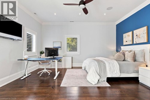 Dark wood-finish flooring, white crown molding, recessed lighting, and a ceiling fan with integrated lighting - 253 Rossmore Boulevard, Burlington, ON - Indoor Photo Showing Other Room
