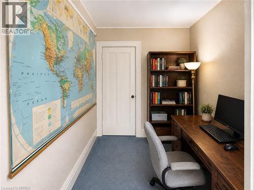 Built-in wood shelving provides plenty of practical storage while adding warmth and character to the space. - 49 Palmerston Avenue, Brantford, ON - Indoor Photo Showing Office