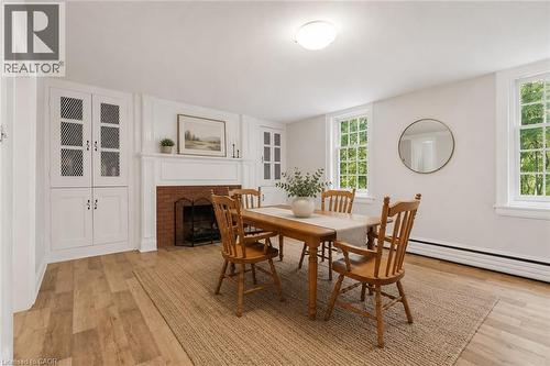 VIRTUALLY STAGED IMAGE - 41 Mill Street, Mississauga, ON - Indoor Photo Showing Dining Room With Fireplace