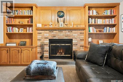 2734 Poplar Place E, Regina, SK - Indoor Photo Showing Living Room With Fireplace