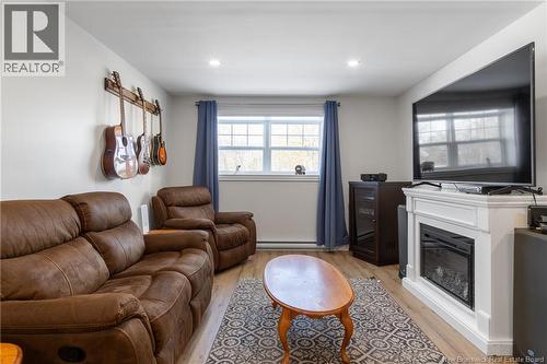 50 Walker Crescent, Hampton, NB - Indoor Photo Showing Living Room With Fireplace
