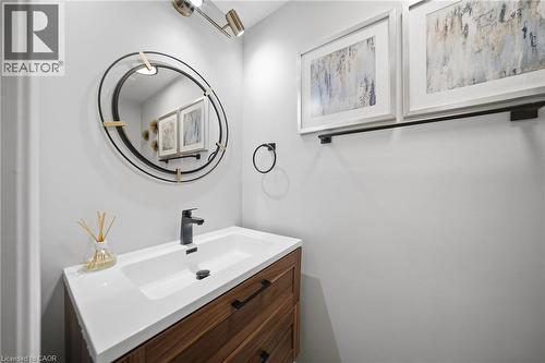 Modern vanity with integrated rectangular sink and matte black faucet - 5184 Red Brush Drive, Mississauga, ON - Indoor Photo Showing Bathroom
