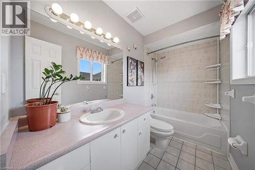 Bathroom featuring an integrated vanity sink with a pink countertop, white cabinetry, and a large wall-mounted mirror - 5184 Red Brush Drive, Mississauga, ON - Indoor Photo Showing Bathroom