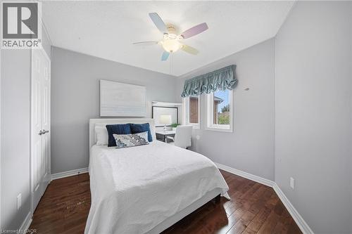 Bedroom featuring wood-finish flooring, a ceiling fan, and painted walls - 5184 Red Brush Drive, Mississauga, ON - Indoor Photo Showing Bedroom