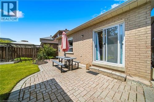 Expansive backyard featuring a brick paver patio, a lush green lawn, and a wooden pergola structure - 5184 Red Brush Drive, Mississauga, ON - Outdoor With Exterior