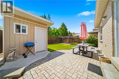 Paved patio area featuring interlocking pavers and a concrete path - 5184 Red Brush Drive, Mississauga, ON - Outdoor