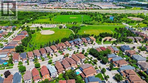 Aerial perspective showcasing a residential area bordered by expansive green spaces - 5184 Red Brush Drive, Mississauga, ON - Outdoor With View