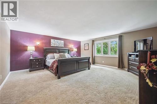 Spacious room featuring broadloom carpeting and a multi-pane window - 119 Sandy Ridge Place, Waterloo, ON - Indoor Photo Showing Bedroom