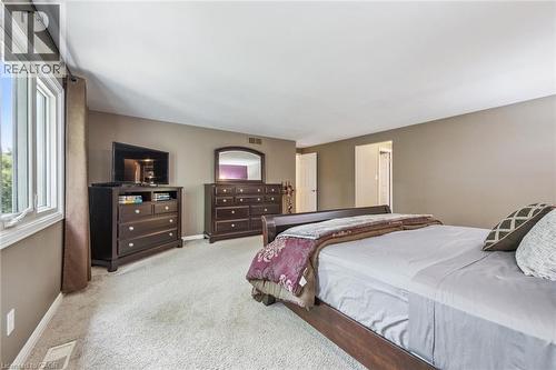 Wall-to-wall carpeting and neutral wall tones - 119 Sandy Ridge Place, Waterloo, ON - Indoor Photo Showing Bedroom