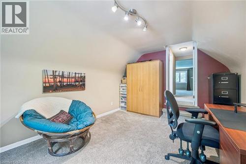 Carpeted room with a vaulted ceiling, track lighting, and a neutral wall color - 119 Sandy Ridge Place, Waterloo, ON - Indoor Photo Showing Other Room