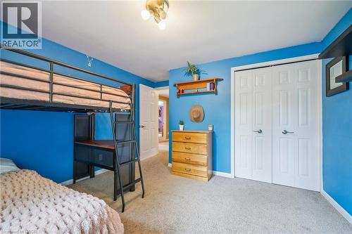 Carpeted flooring, bi-fold closet doors, and overhead lighting - 119 Sandy Ridge Place, Waterloo, ON - Indoor Photo Showing Bedroom