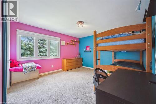 Wall-to-wall carpeting, multiple windows with white trim, and a built-in window bench - 119 Sandy Ridge Place, Waterloo, ON - Indoor Photo Showing Bedroom