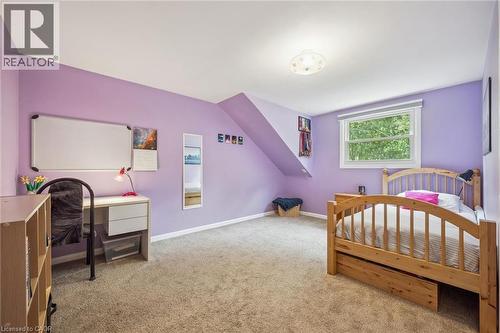 Wall-to-wall carpeting with an angled ceiling feature, recessed window, and flush-mount ceiling light - 119 Sandy Ridge Place, Waterloo, ON - Indoor Photo Showing Bedroom