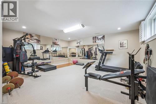 Spacious room with carpeted flooring, mirrored walls, recessed lighting, and a built-in barre - 119 Sandy Ridge Place, Waterloo, ON - Indoor Photo Showing Gym Room