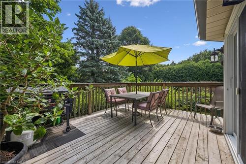 Wood deck with a slatted railing and surrounding mature trees - 119 Sandy Ridge Place, Waterloo, ON - Outdoor With Deck Patio Veranda With Exterior