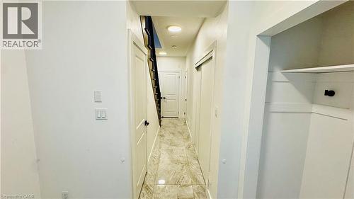 Hallway featuring recessed lighting, panel doors, a built-in closet with shelving, and tile flooring - 1159 Lloyd Landing, Milton, ON - Indoor Photo Showing Other Room