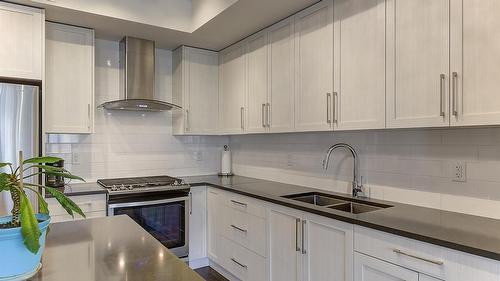 225-4380 Lakeshore Road, Kelowna, BC - Indoor Photo Showing Kitchen With Stainless Steel Kitchen With Double Sink With Upgraded Kitchen