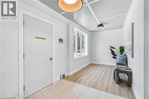 Entryway featuring a coffered ceiling with recessed lighting, large window, wood-finish flooring, and white interior walls - 10 Comet Avenue Unit# #1 (Main), Hamilton, ON - Indoor Photo Showing Other Room