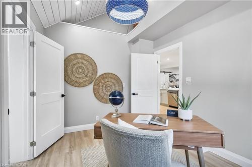 Room featuring light wood-finish flooring, white doors with matte black hardware, and a vaulted ceiling with white shiplap detailing - 10 Comet Avenue Unit# #1 (Main), Hamilton, ON - Indoor Photo Showing Office