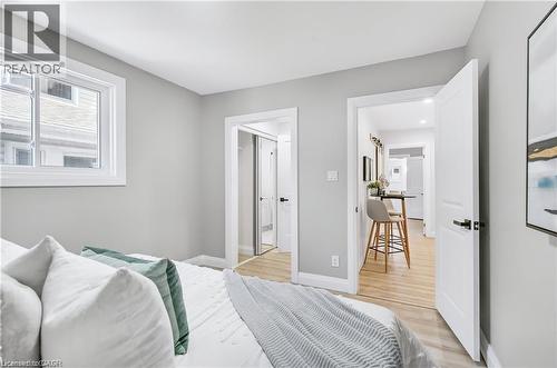Bright room with light gray walls, white trim, and a white framed window - 10 Comet Avenue Unit# #1 (Main), Hamilton, ON - Indoor Photo Showing Bedroom
