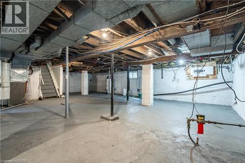 Spacious unfinished basement with concrete flooring and exposed ceiling joists - 10 Comet Avenue Unit# #1 (Main), Hamilton, ON - Indoor Photo Showing Basement