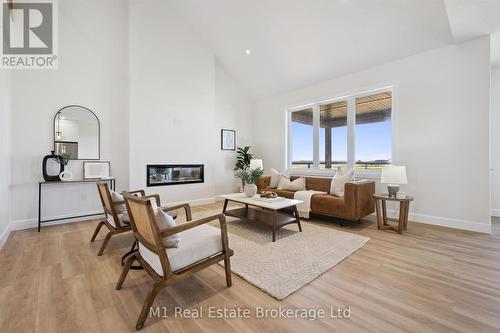 74 Bedell Drive, Mapleton, ON - Indoor Photo Showing Other Room With Fireplace