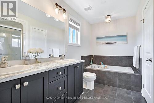 Primary ensuite - 2 sinks, soaker tub, and shower - 48 Ambrosia Path, St. Thomas, ON - Indoor Photo Showing Bathroom