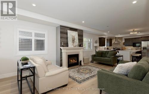 247 Sunset Drive, West Perth (Mitchell), ON - Indoor Photo Showing Living Room With Fireplace