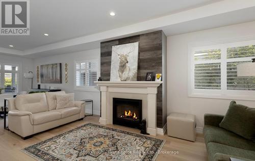 247 Sunset Drive, West Perth (Mitchell), ON - Indoor Photo Showing Living Room With Fireplace