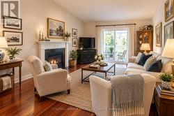 Virtually staged living room leads to back deck - 