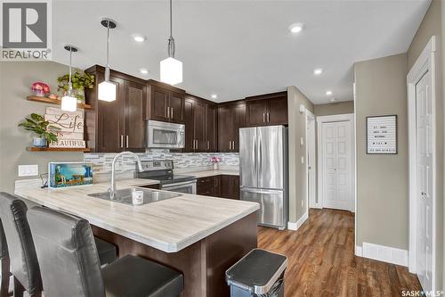 6F 110 Centennial Boulevard, Warman, SK - Indoor Photo Showing Kitchen With Stainless Steel Kitchen With Double Sink With Upgraded Kitchen