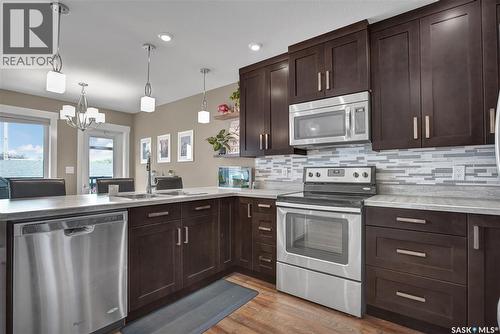 6F 110 Centennial Boulevard, Warman, SK - Indoor Photo Showing Kitchen With Stainless Steel Kitchen With Double Sink With Upgraded Kitchen