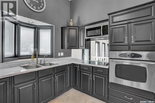 302 Doiron Road N, Regina, SK - Indoor Photo Showing Kitchen With Double Sink