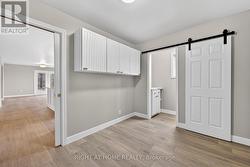 Mud Room with Powed Room and Garage Access - 