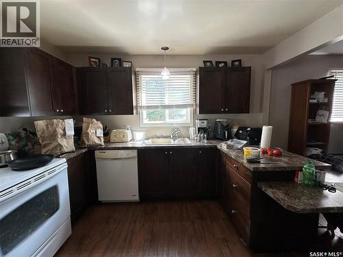 242 Third Avenue N, Kamsack, SK - Indoor Photo Showing Kitchen With Double Sink