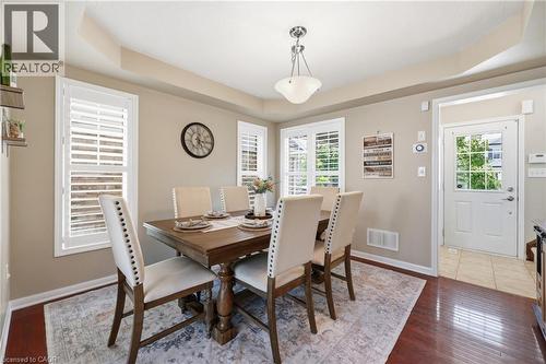 Tray ceiling with a central pendant light fixture - 171 Chase Crescent, Cambridge, ON - Indoor Photo Showing Dining Room