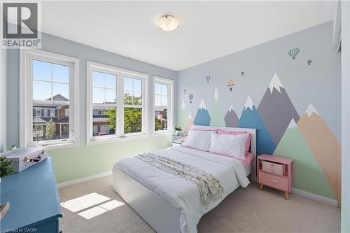Three large windows with grid inserts, wall-to-wall carpeting, contemporary ceiling light fixture - 171 Chase Crescent, Cambridge, ON - Indoor Photo Showing Bedroom