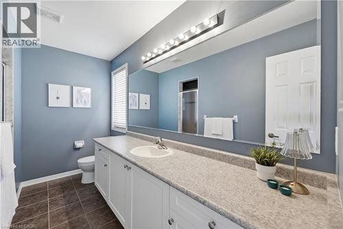 Extended vanity with integrated sink, white cabinetry, and a large wall-mounted mirror - 171 Chase Crescent, Cambridge, ON - Indoor Photo Showing Bathroom
