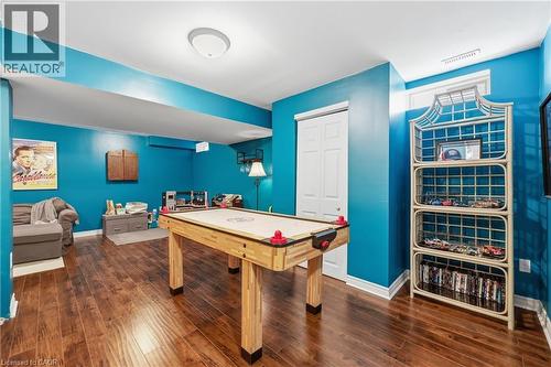 Wood-finish flooring throughout, bright wall color, recessed lighting, and a built-in closet with bifold doors - 171 Chase Crescent, Cambridge, ON - Indoor Photo Showing Other Room