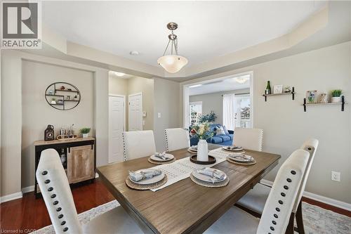 Tray ceiling with a central pendant light fixture - 171 Chase Crescent, Cambridge, ON - Indoor Photo Showing Dining Room