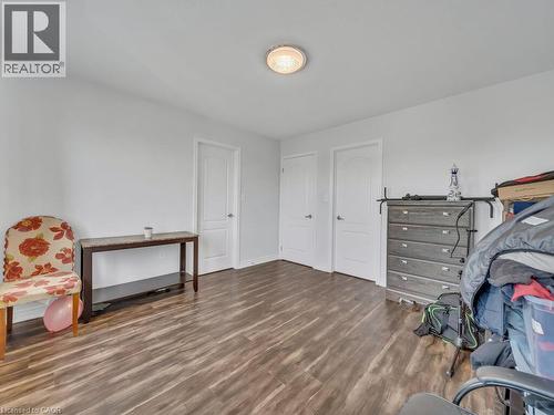 Wood-finish flooring, white walls, and a ceiling-mounted light fixture - 227 Baldwin Drive Unit# Main, Cambridge, ON - Indoor