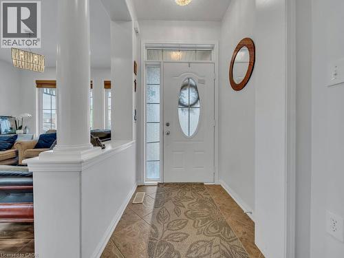 Entryway featuring tile flooring, a white paneled door with decorative glass, and an overhead transom window - 227 Baldwin Drive Unit# Main, Cambridge, ON - Indoor Photo Showing Other Room