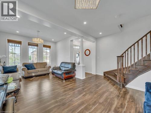 Wood-finish flooring throughout, recessed lighting, and large windows with blinds - 227 Baldwin Drive Unit# Main, Cambridge, ON - Indoor Photo Showing Living Room