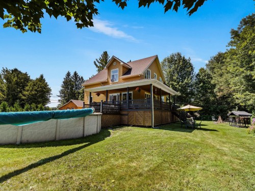 Extérieur - 37 Ch. Mercier, Bury, QC - Outdoor With Above Ground Pool With Deck Patio Veranda