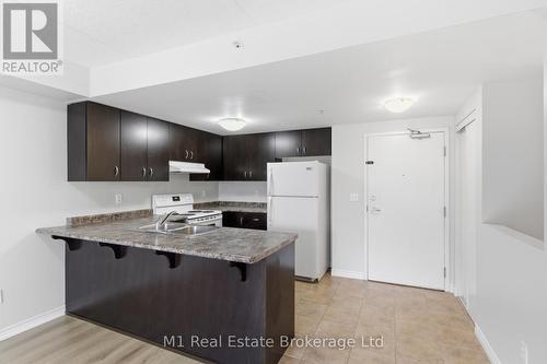 311 - 45 Goodwin Drive, Guelph (Pineridge/Westminster Woods), ON - Indoor Photo Showing Kitchen With Double Sink