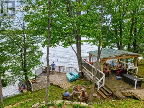 Lifestyle shot, entertain on all levels - 66 Scott Lane, Rideau Lakes, ON - Outdoor With Body Of Water With Deck Patio Veranda
