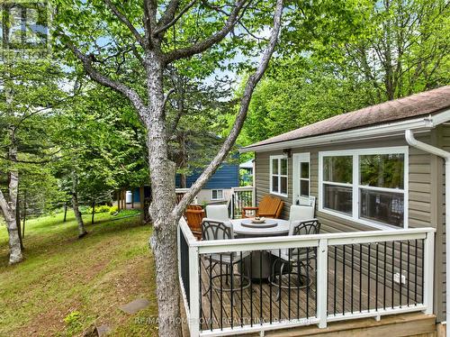 Front deck great for sunset dinners! - 66 Scott Lane, Rideau Lakes, ON - Outdoor With Deck Patio Veranda With Exterior