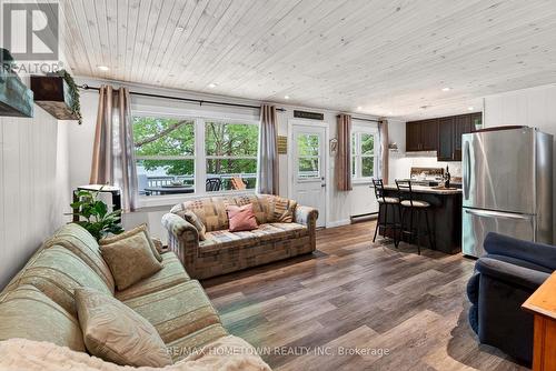 Living room with walk-out to front deck. - 66 Scott Lane, Rideau Lakes, ON - Indoor Photo Showing Other Room