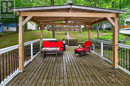 Covered Boathouse patio, great for kicking back - 66 Scott Lane, Rideau Lakes, ON - Outdoor With Deck Patio Veranda
